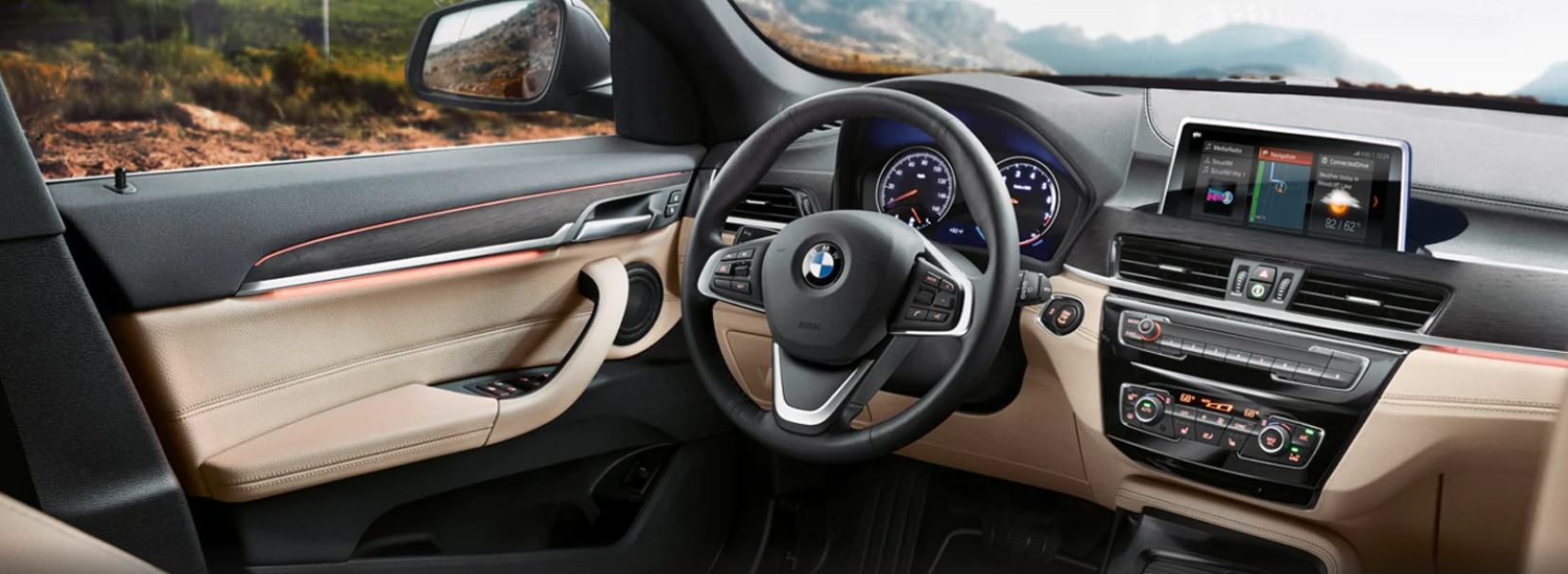BMW X1 Interior shot over looking a mountian view