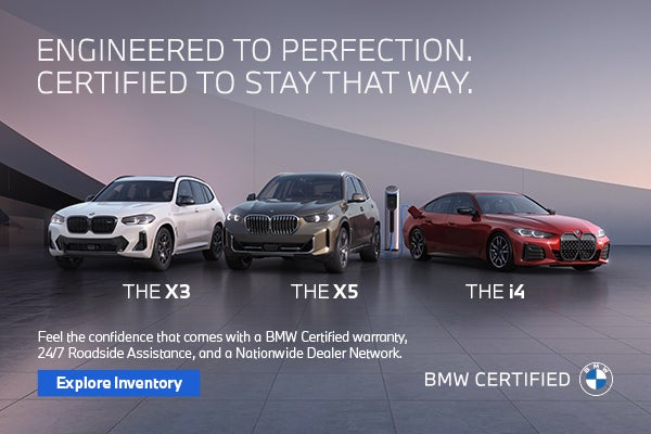 BMW Certified X3, X5, and i4 parked on a modern rooftop at sunrise.