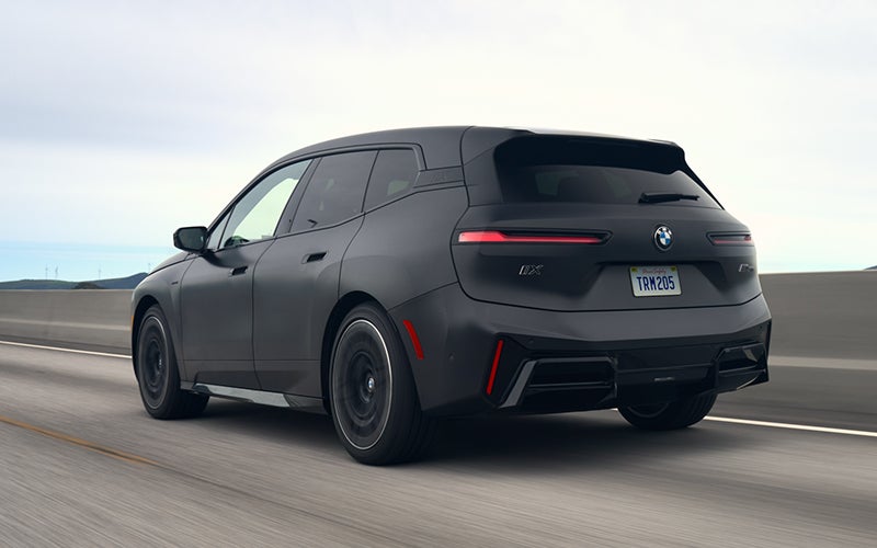 The BMW iX M70 driving rear shot. | BMW of Grand Blanc in Grand Blanc MI