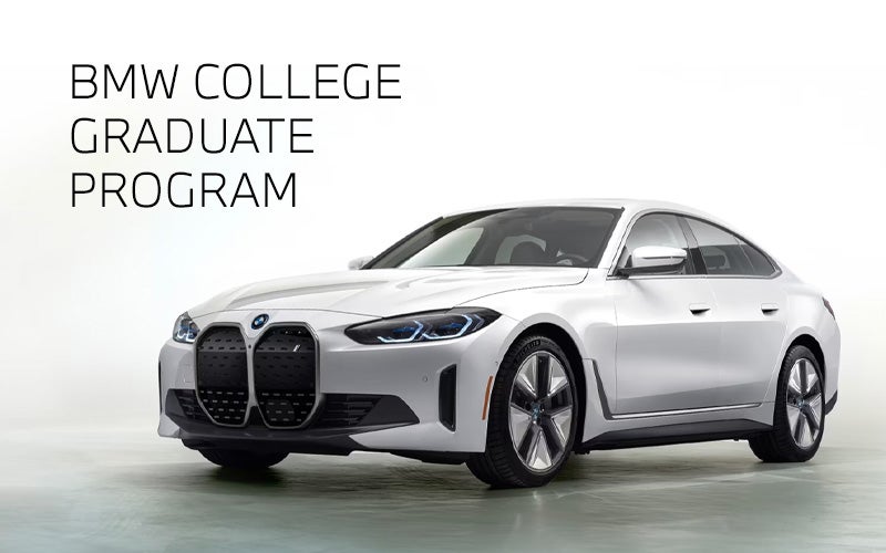 White BMW i4 parked. BMW College Graduate Program. | BMW of Grand Blanc in Grand Blanc MI