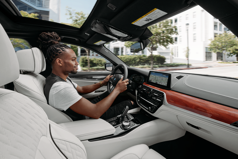 Man driving a bmw in the city