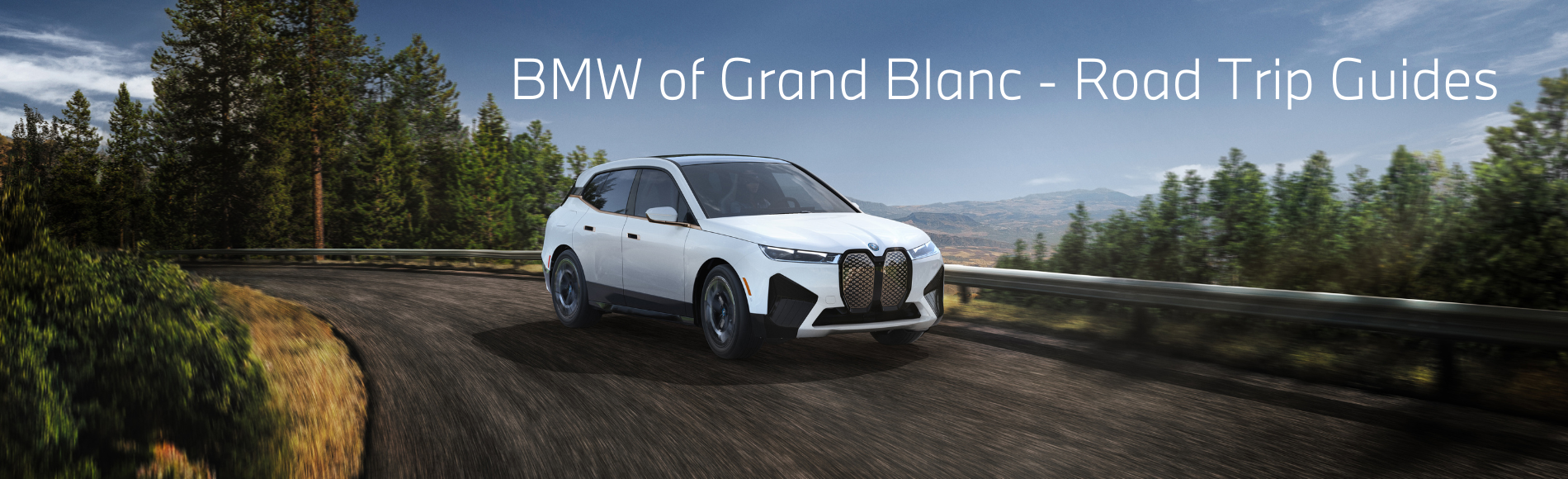 A white BMW iX Driving on a roadf